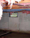 Tennessee, Mississippi and Arkansas crawl space with vents, showing mold, rot, and fiberglass insulation dripping off the ceiling.