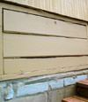 an old-fashioned crawl space door in Holly Springs about to be replaced