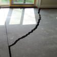 a huge crack in a concrete slab floor in Cordova