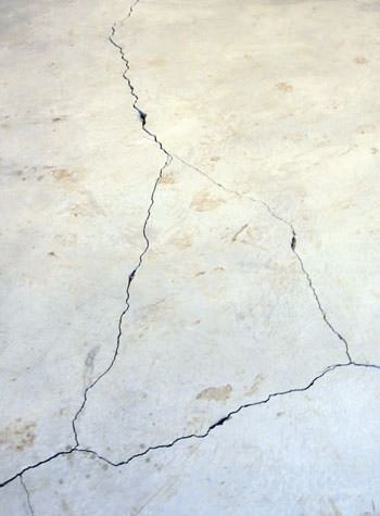 severely cracked, heaving slab floors in a home in Horn Lake