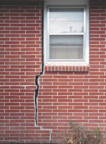 severe foundation wall cracks along a window in New Albany