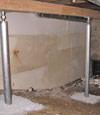 A system of crawl space support posts adding structural support to a crawl space in Brownsville