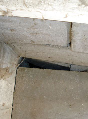 inward rotation of a foundation wall damaged by street creep in a garage in New Albany