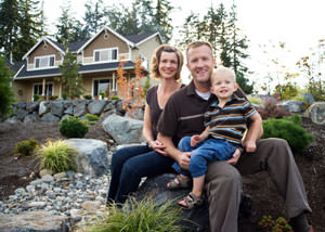 A happy family outside a home with a repaired foundation in Horn Lake