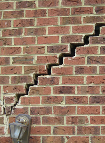 major cracking of a brick foundation wall in Byhalia