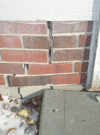 Severe street creep damage to a garage wall outside a Wynne home