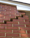 Serious damage to a foundation wall due to settlement of a home in Arlington