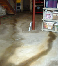 Flooding entering a basement through a floor crack in Arlington