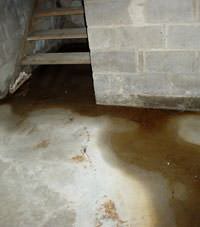 Flooding floor cracks by a hatchway door in Atoka