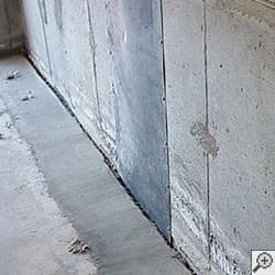 an ugly basement weeping tile drainage system that's clogged and not working in Germantown.