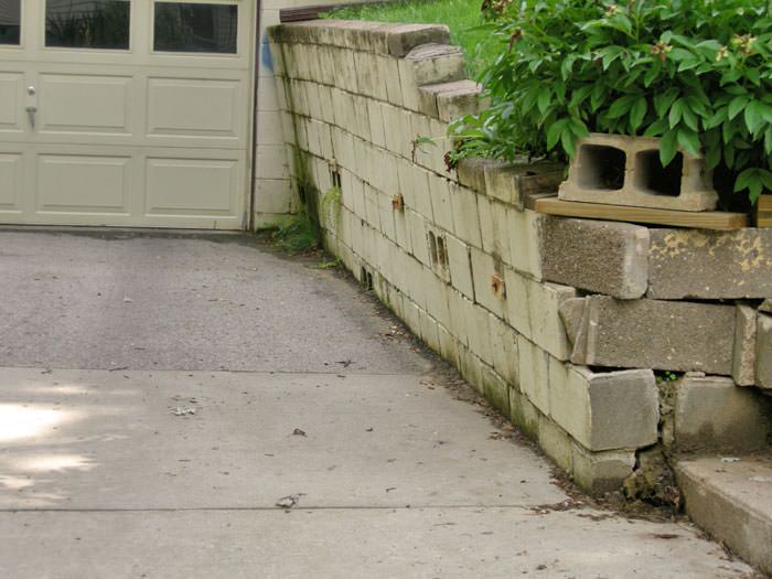 a failing retaining wall around a driveway in Memphis