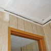 The ceiling and wall separating as the wall sinks with the slab floor in a Cabot home