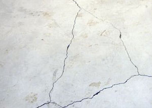 cracks in a slab floor consistent with slab heave in Arlington.