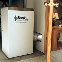 A basement dehumidifier with an ENERGY STAR® rating ducting dry air into a finished area of the basement  in Hot Springs Village