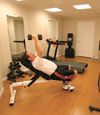 a basement gym and workout room with a wood laminate flooring, installed in Olive Branch, TN, MS, and AR